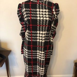 A line dress w flare bottom and bell sleeves .